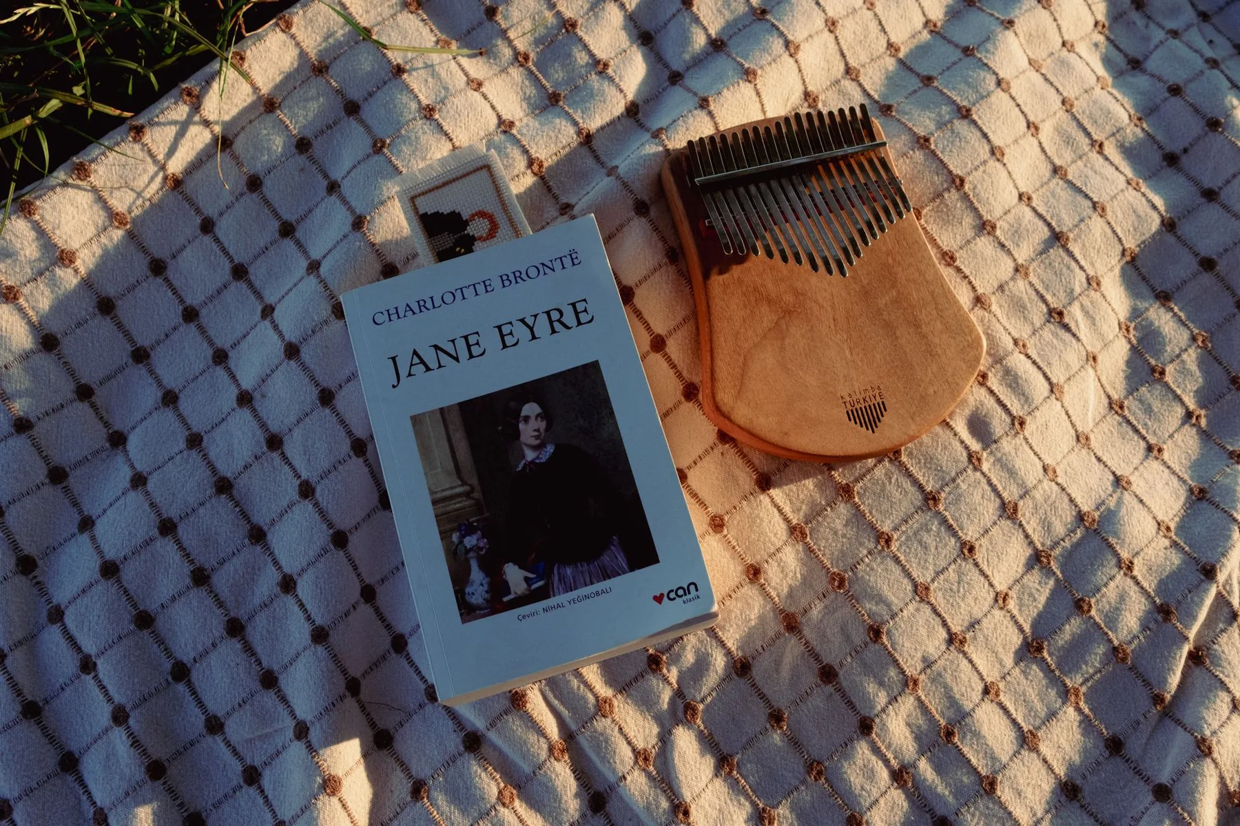 Kalimba on a blanket with a book Kalimba on a blanket with a book