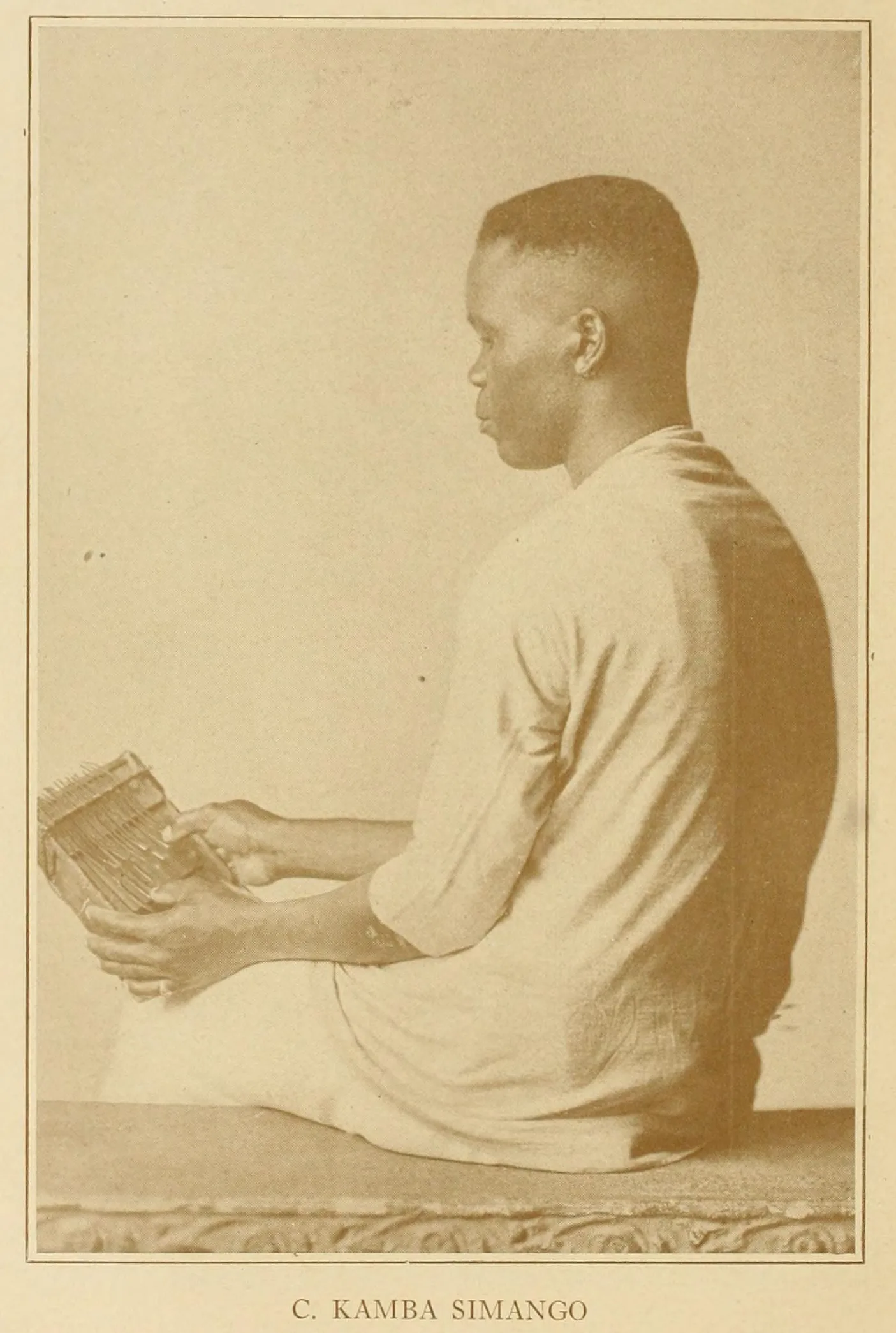Musician holding an old kalimba