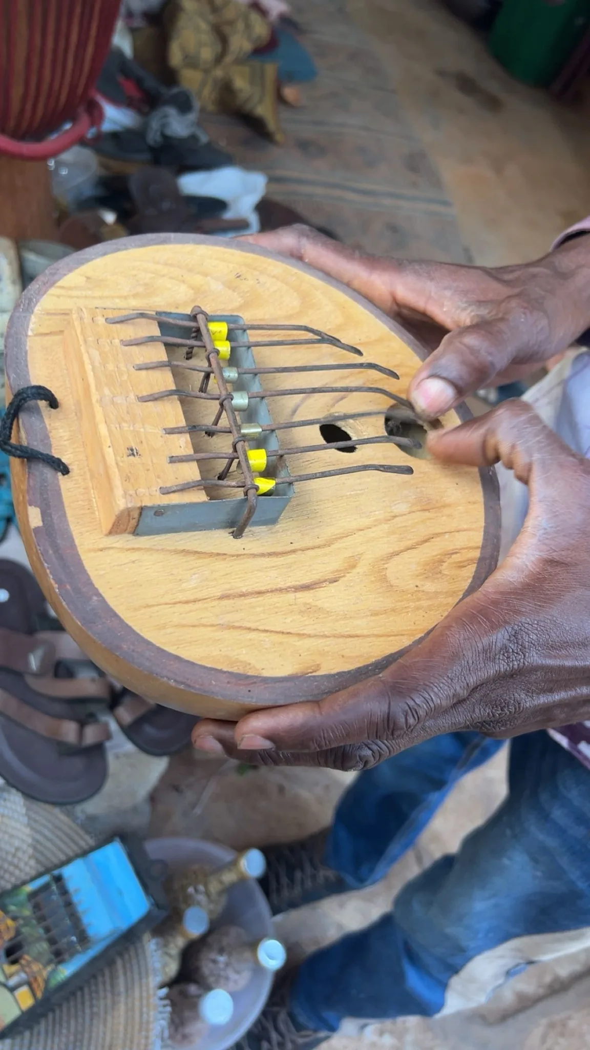 Wooden kalimba held in hand Wooden kalimba held in hand