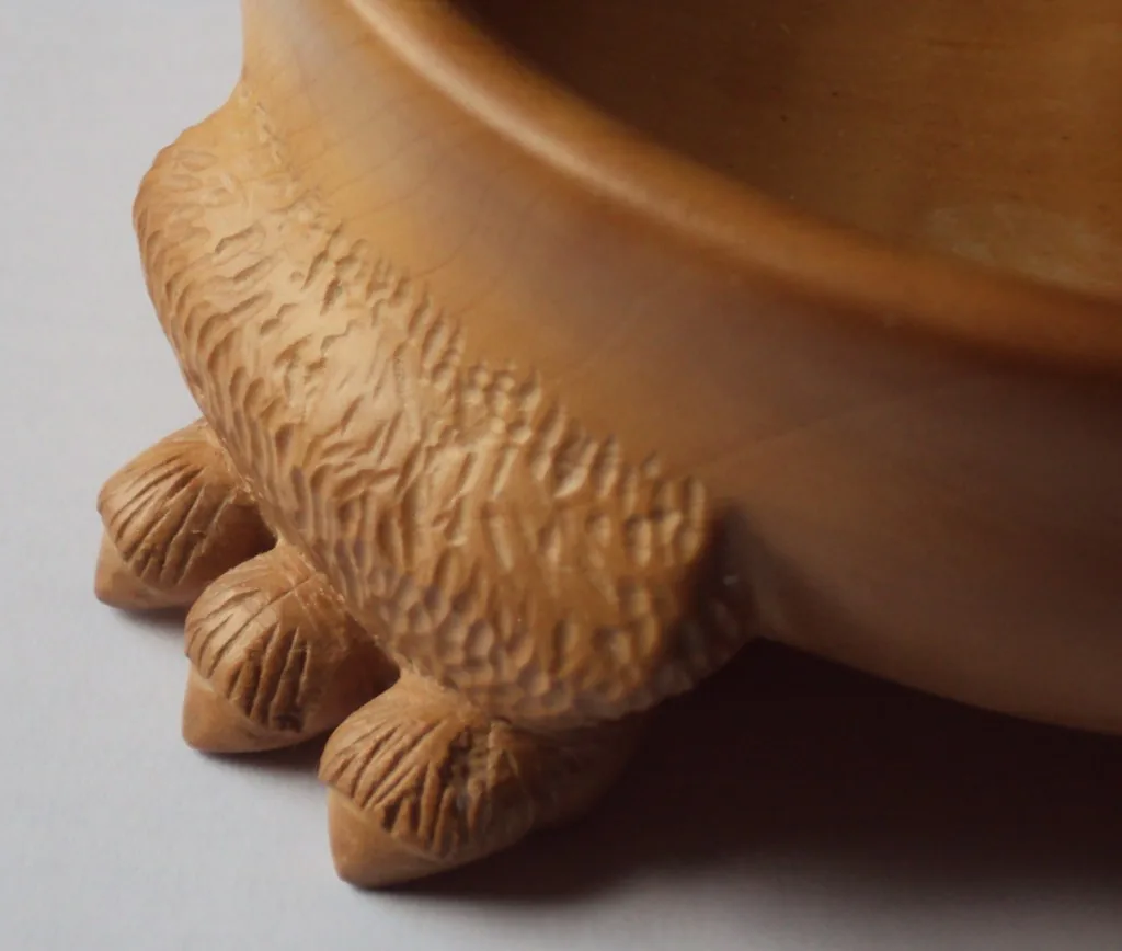 Carved detail of a Tibetan bowl Carved detail of a Tibetan bowl