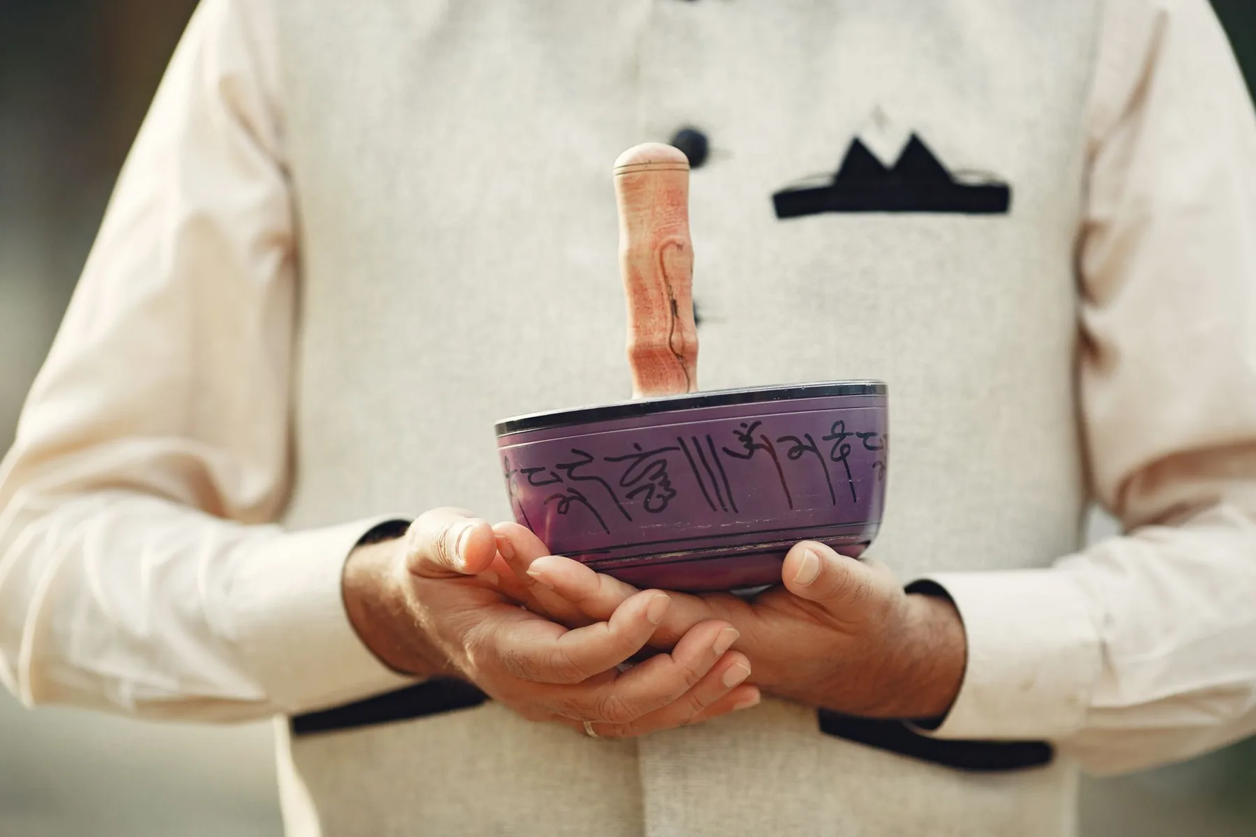 Tibetan singing bowl held with a mallet