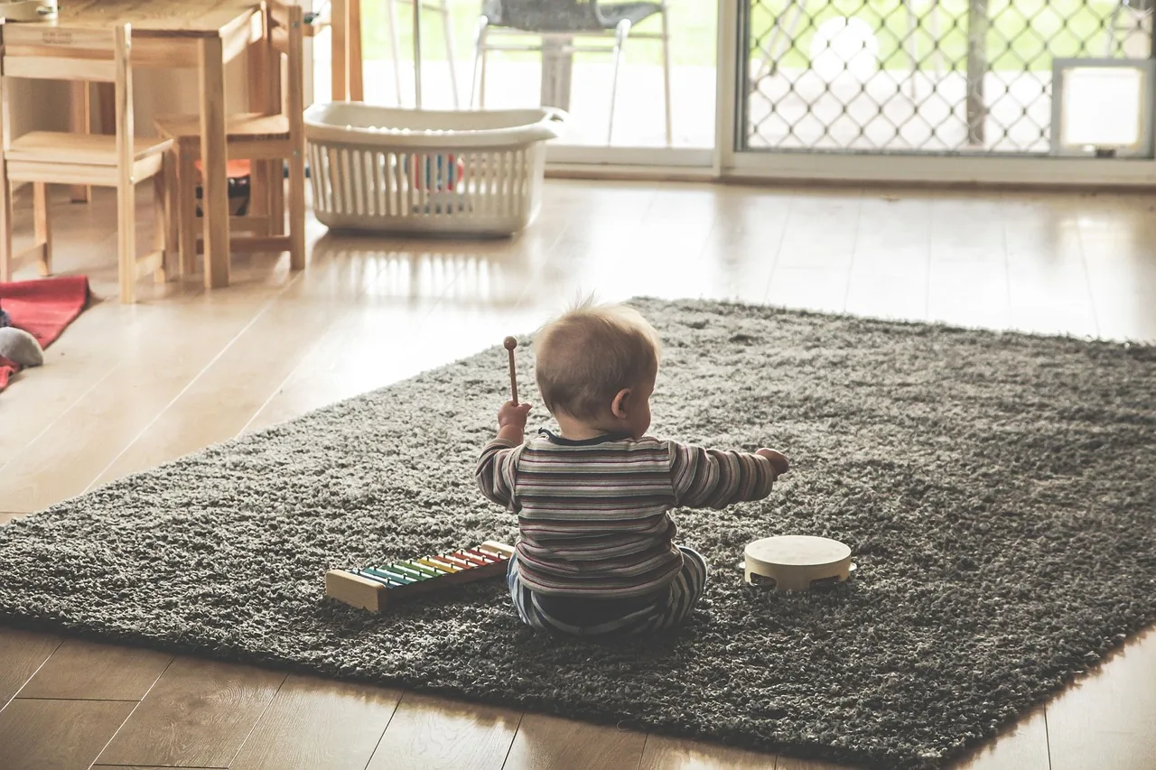 Child with percussion instruments Child with percussion instruments