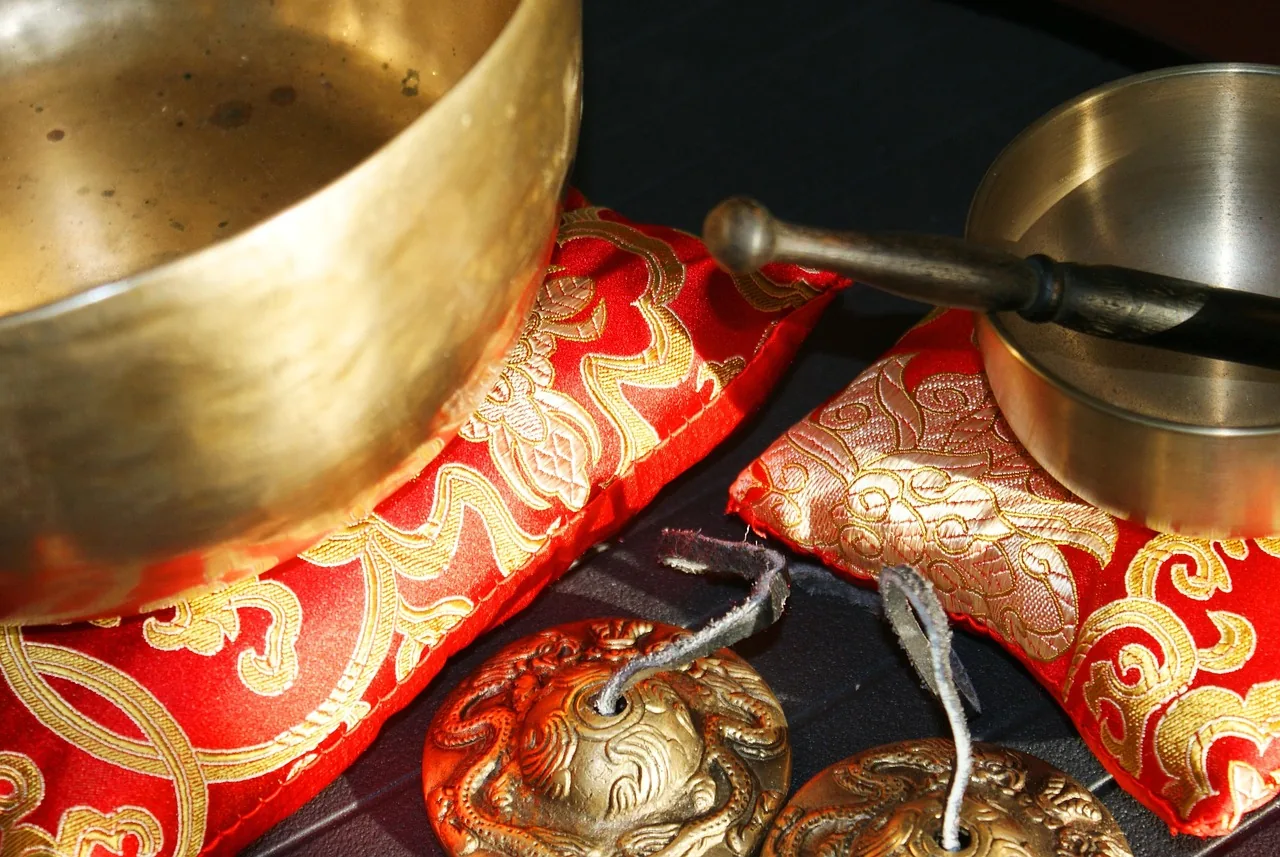 singing bowls on red cushions singing bowls on red cushions