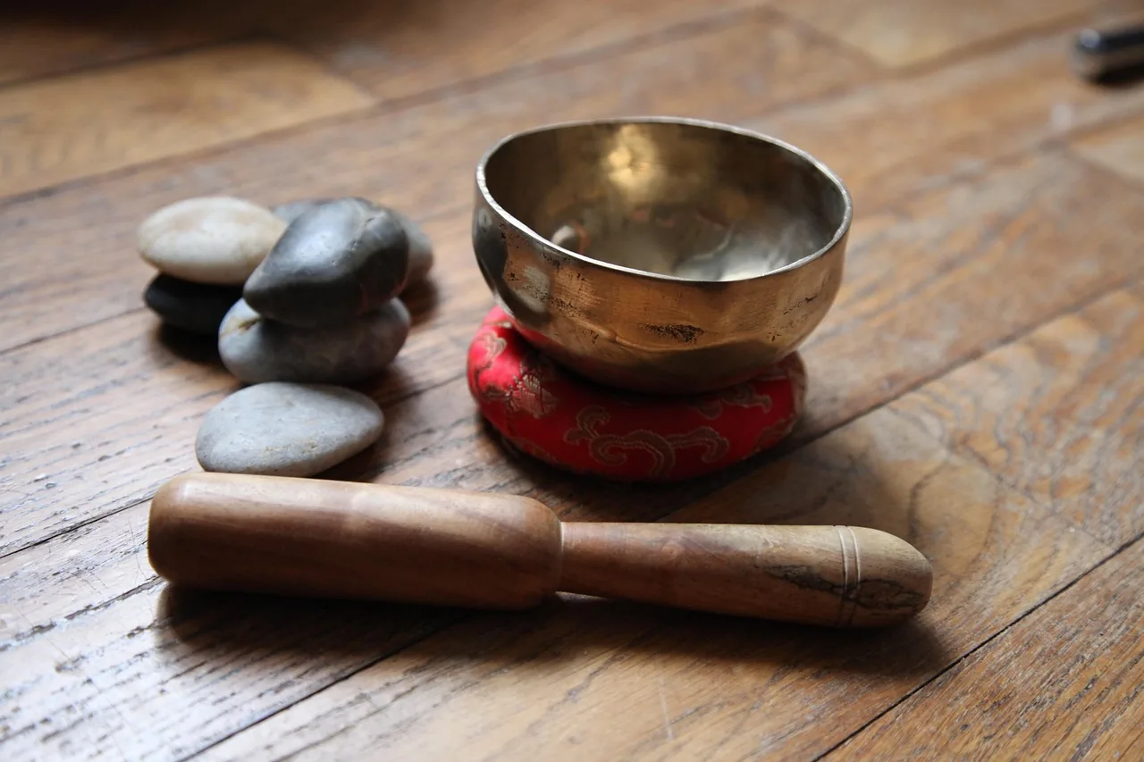 relaxing Tibetan bowl on a wooden floor relaxing Tibetan bowl on a wooden floor
