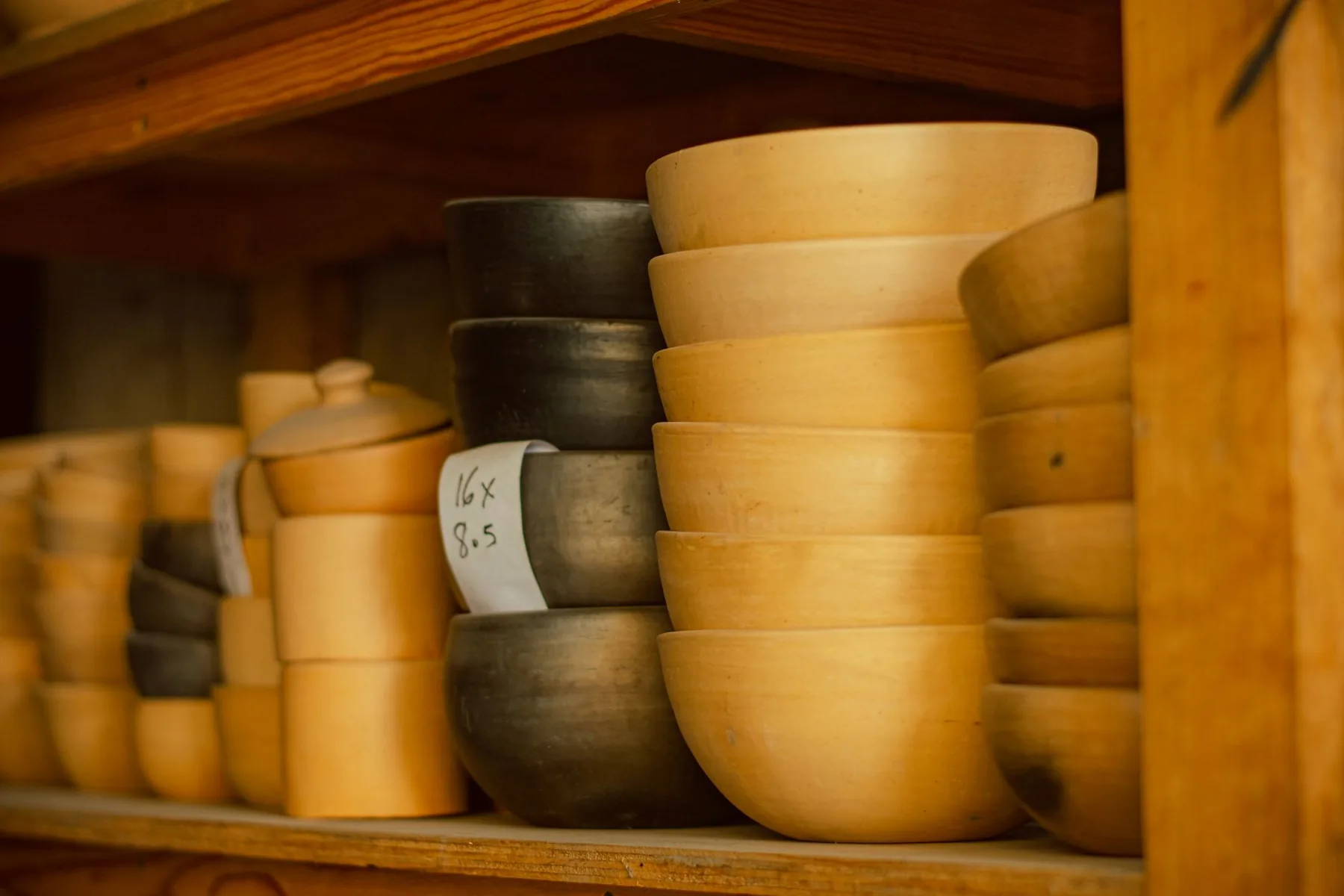 Stacked Tibetan singing bowls on a shelf