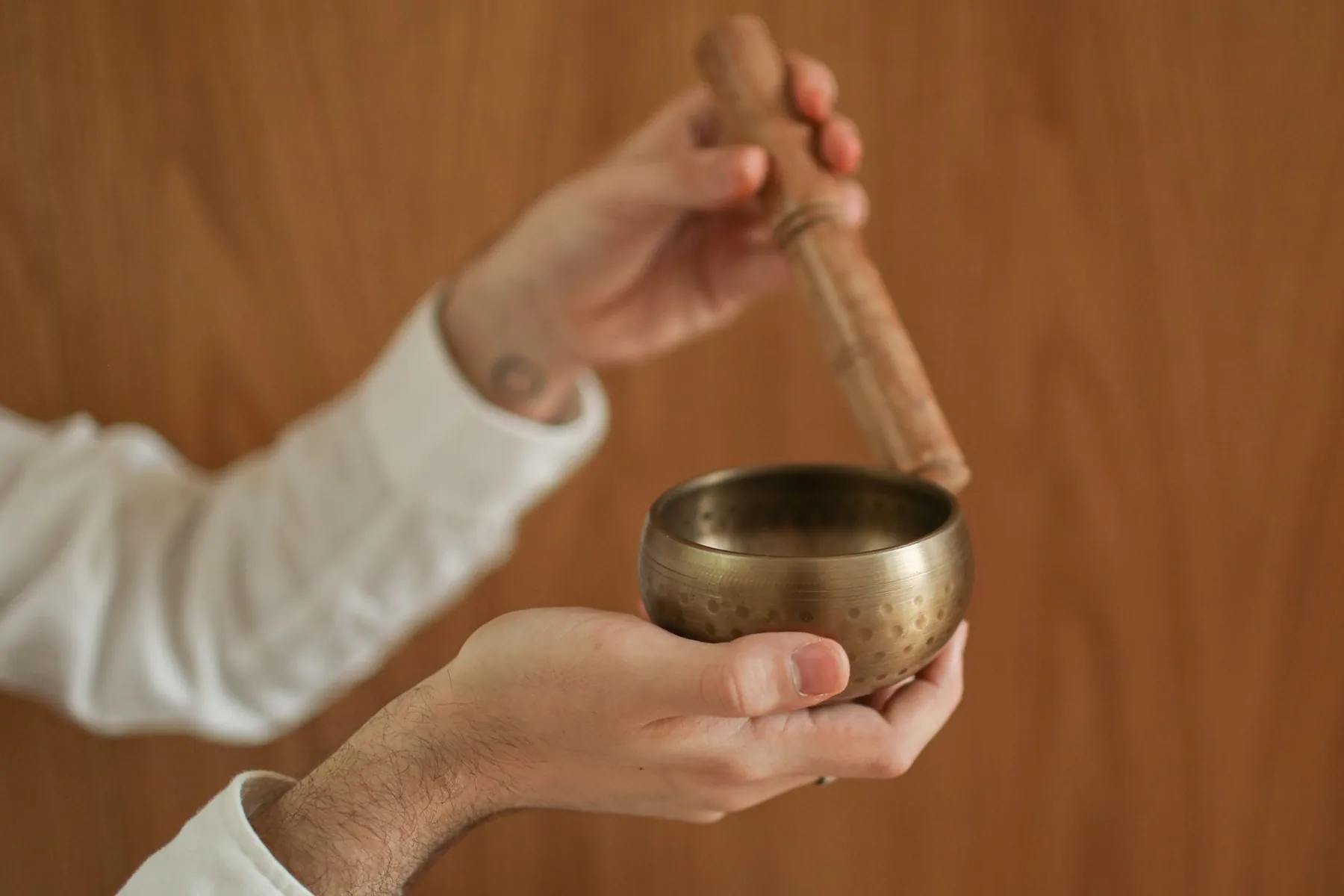 Tibetan bowl held with mallet Tibetan bowl held with mallet