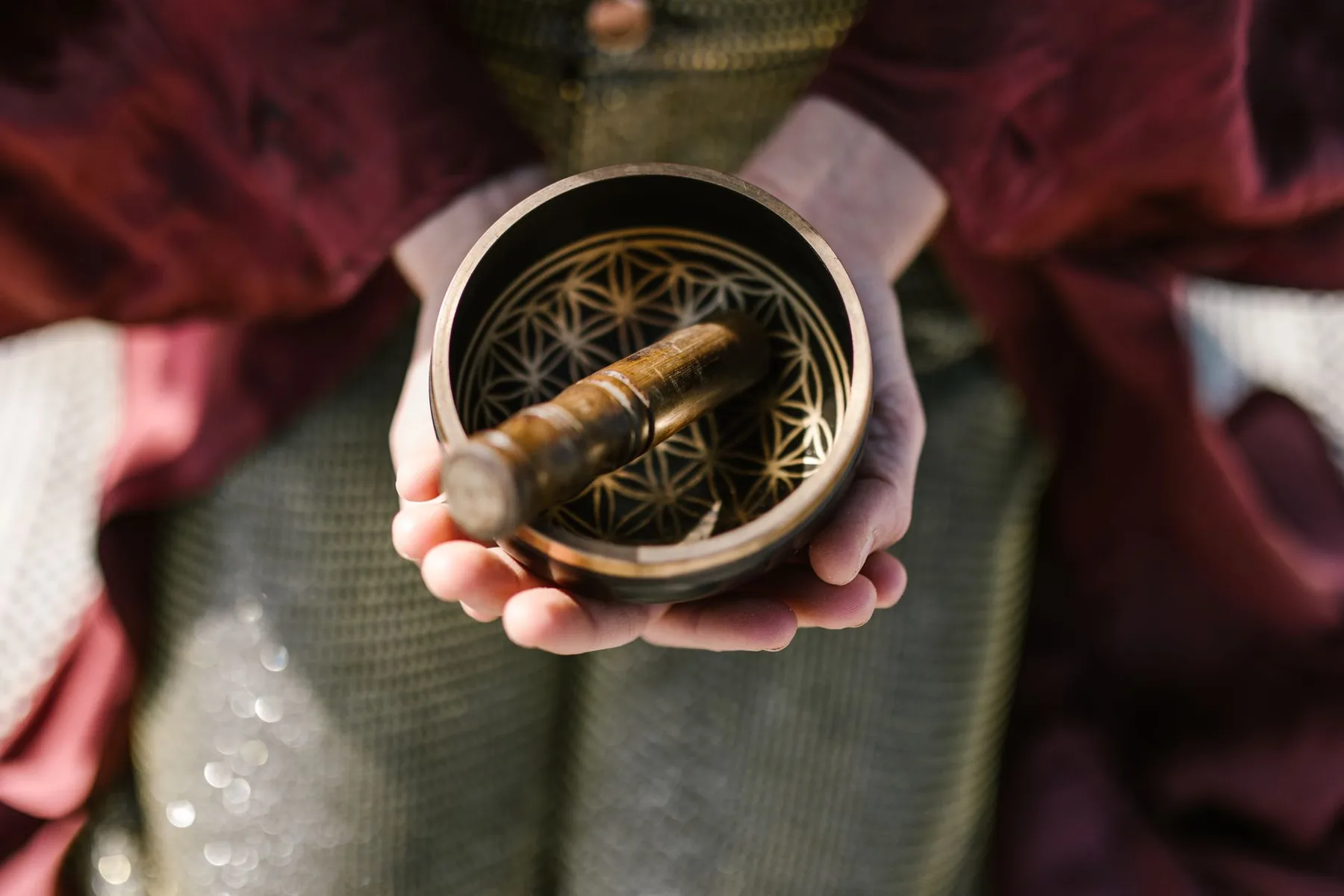 Tibetan bowl with mallet in hand Tibetan bowl with mallet in hand