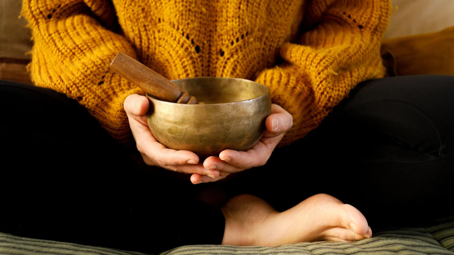 Tibetan singing bowl held during meditation Tibetan singing bowl held during meditation