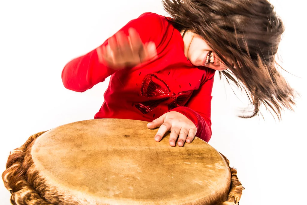 hand playing a large drum hand playing a large drum