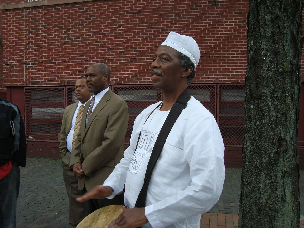 Musician playing a frame drum Musician playing a frame drum