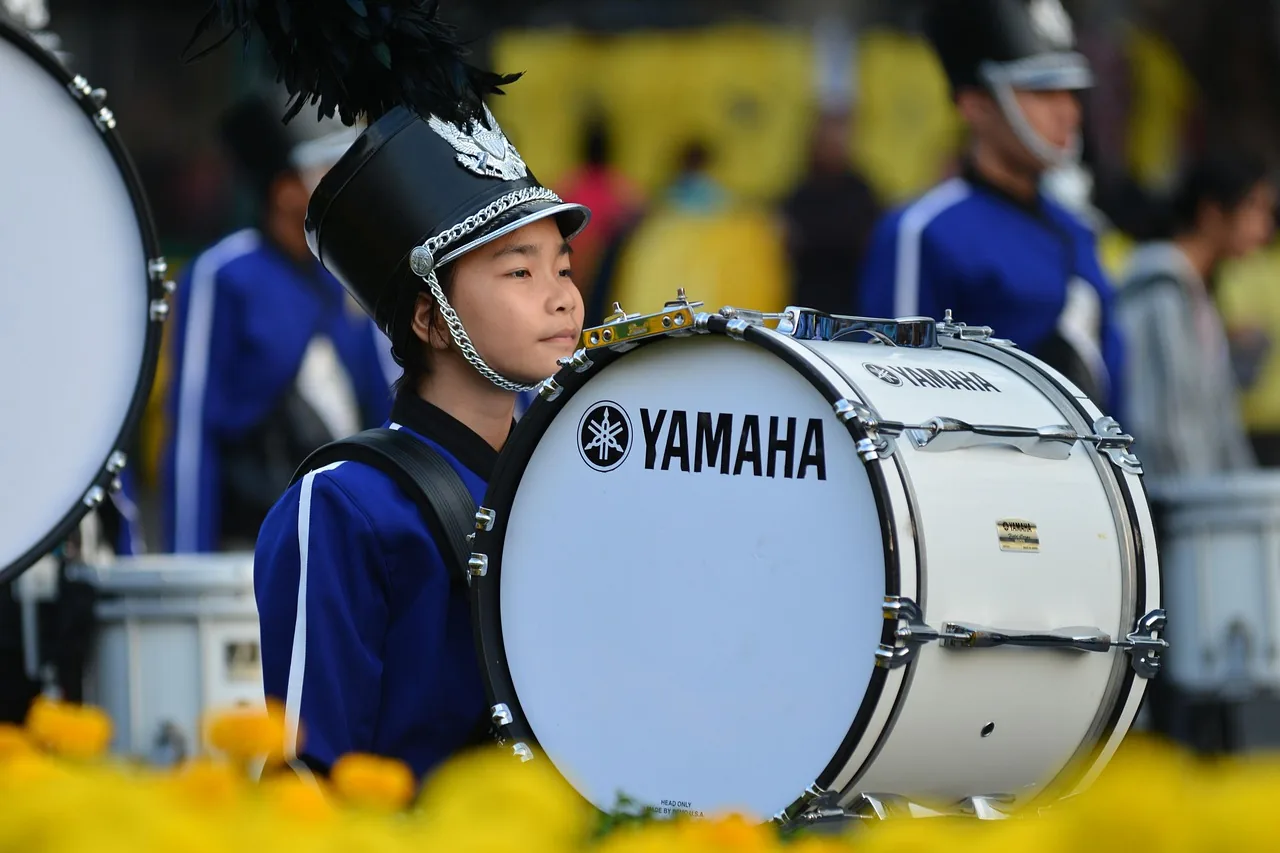 Young musician with bass drum Young musician with bass drum