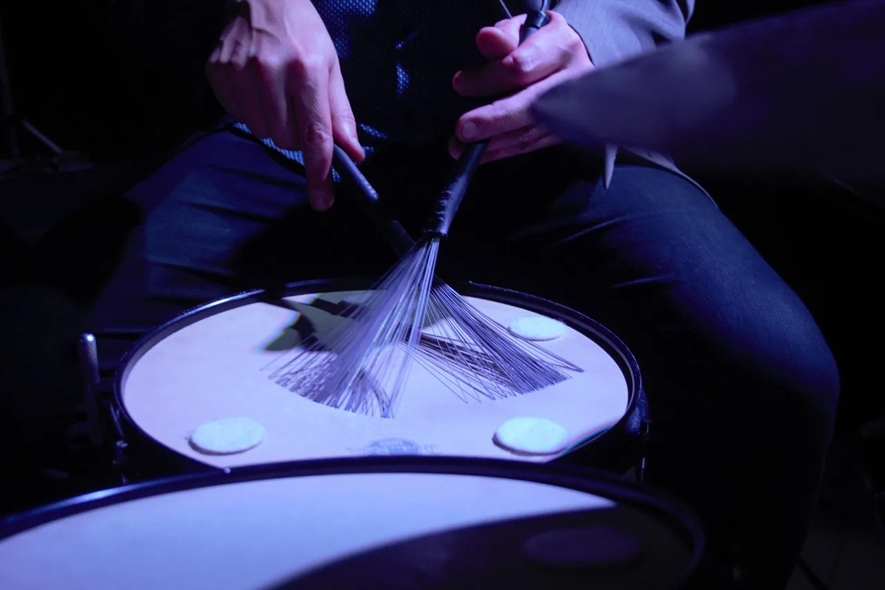 Brushes playing on a drum Brushes playing on a drum