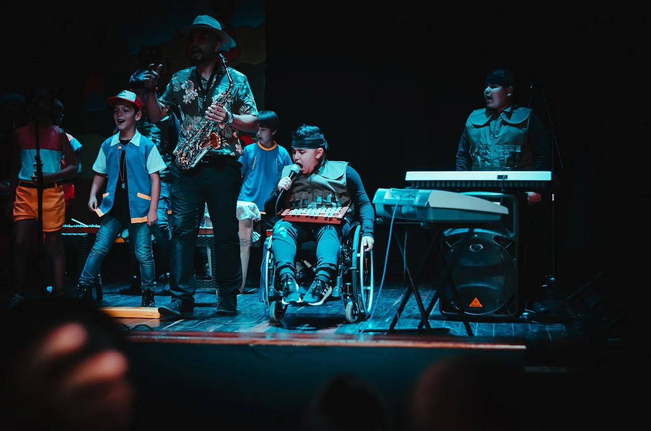 Children playing percussion on stage Children playing percussion on stage