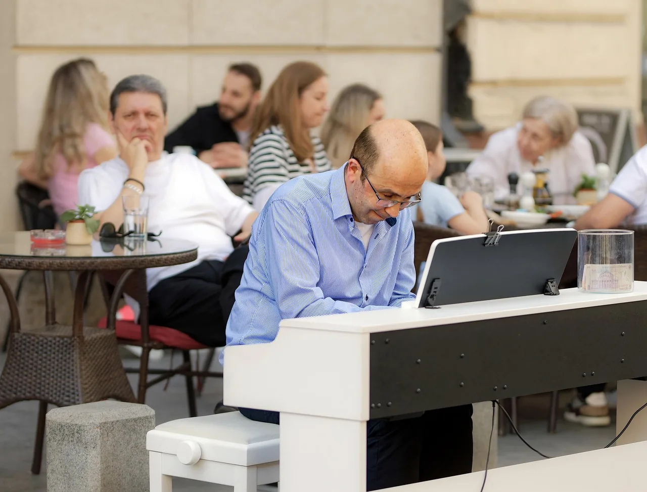 musician playing piano on a terrace musician playing piano on a terrace