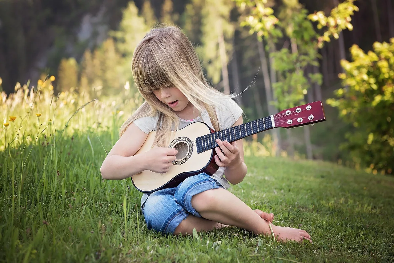 child playing guitar child playing guitar