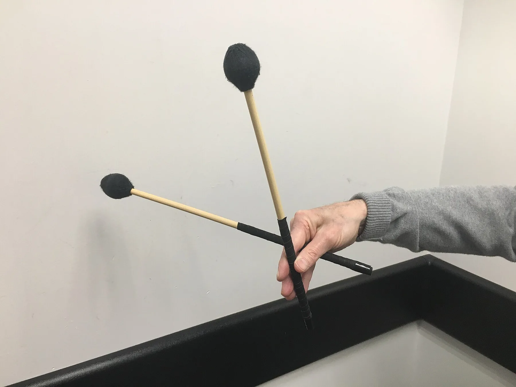 percussion mallets held in hand